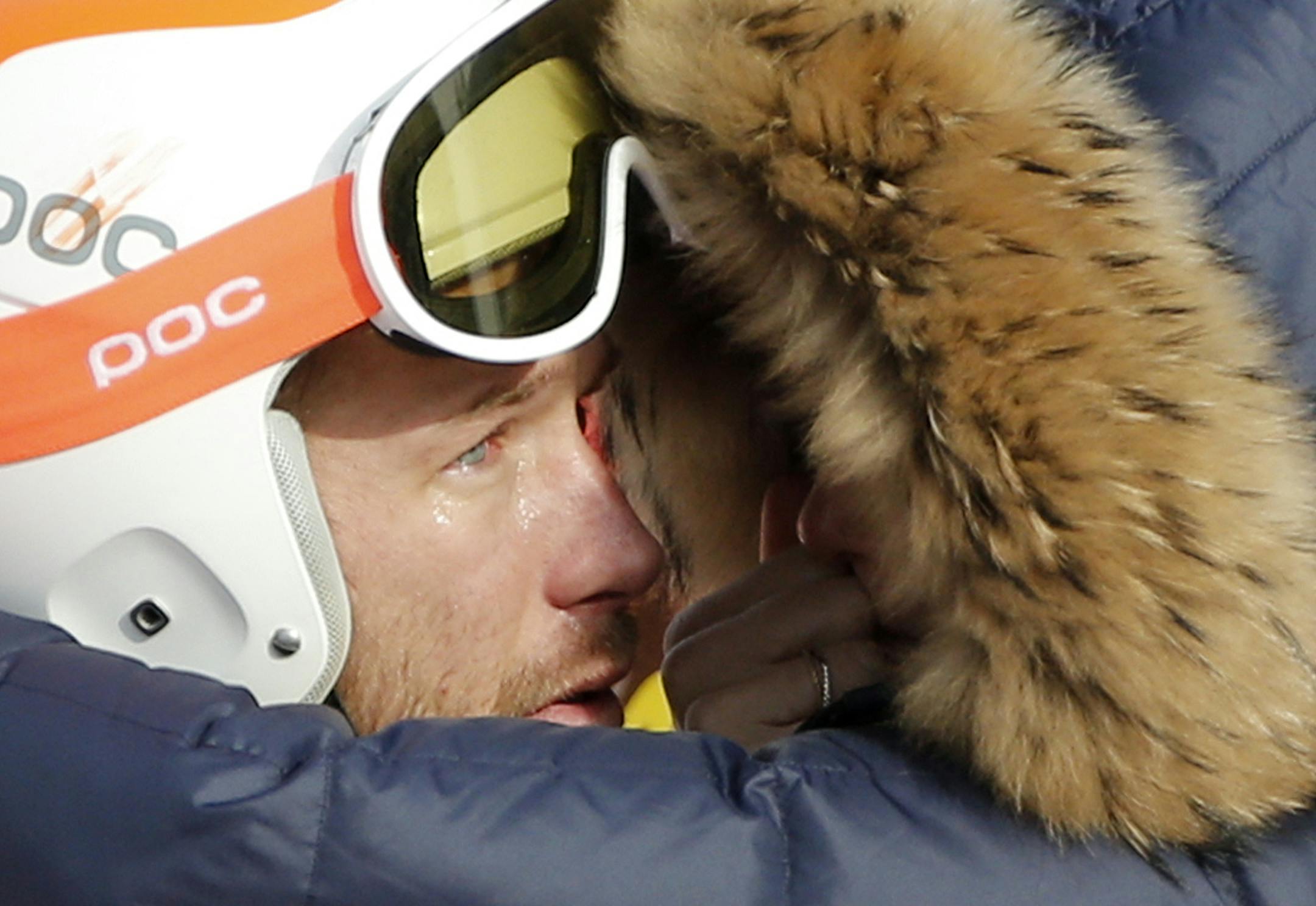 Men's super-G joint bronze medal winner Bode Miller of the United States is consoled by his wife, Morgan, at the Sochi 2014 Winter Olympics, Sunday, Feb. 16, 2014, in Krasnaya Polyana, Russia. (AP Photo/Christophe Ena)