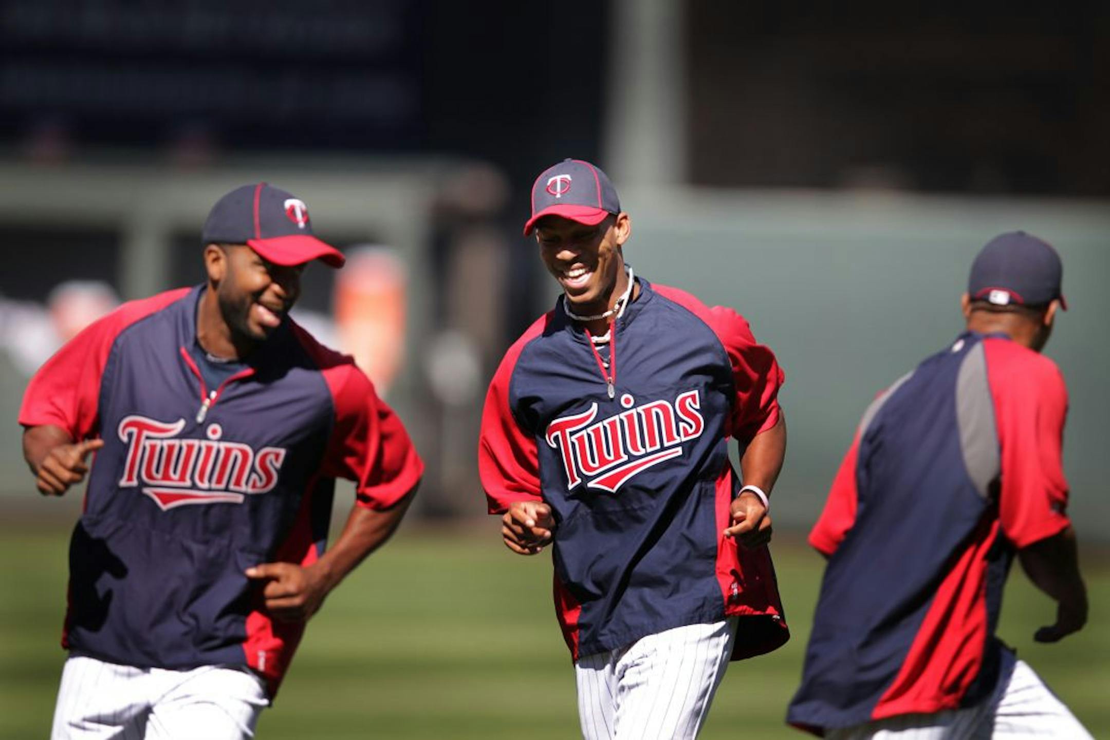 Twins first round draft pick Byron Buxton (center) warmed up with Denard Span left and Ben Revere before the game with the Philadelphia Phillies June 12, 2012 in Minneapolis, MN.