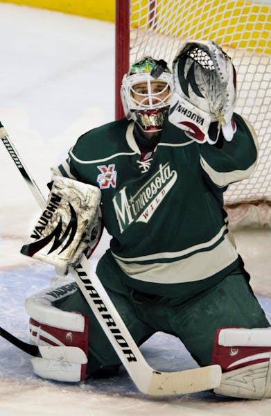 Niklas Backstrom made a save in the first period Monday night.
