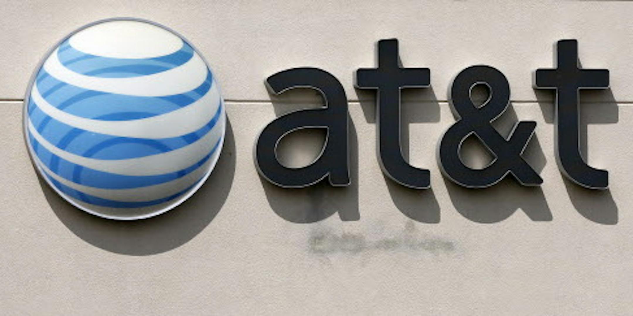 FILE In this May 14, 2014 file photo, an AT&T logo is seen on a store in Dedham, Mass. In a big win for the Obama administration, a federal appeals court on Tuesday upheld the government's "net neutrality" rules that require internet providers to treat all web traffic equally. (AP Photo/Steven Senne, File)