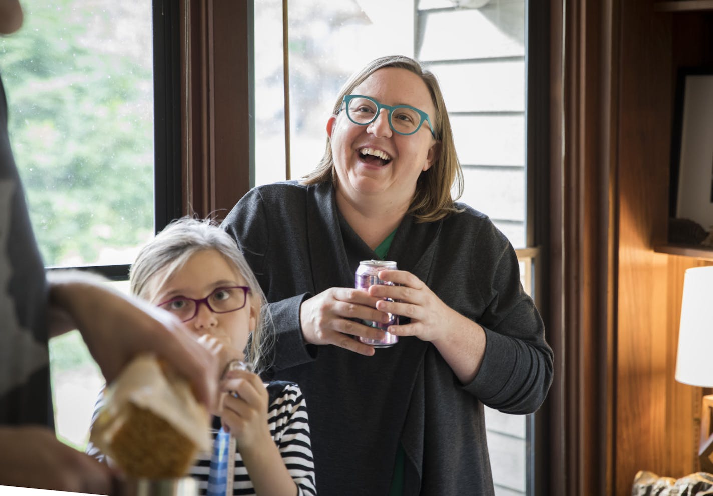 Cathy Cozad during a first day of school after-party at her house in Edina. Cozad recently went back to work after three years of being a stay-at-home mom.