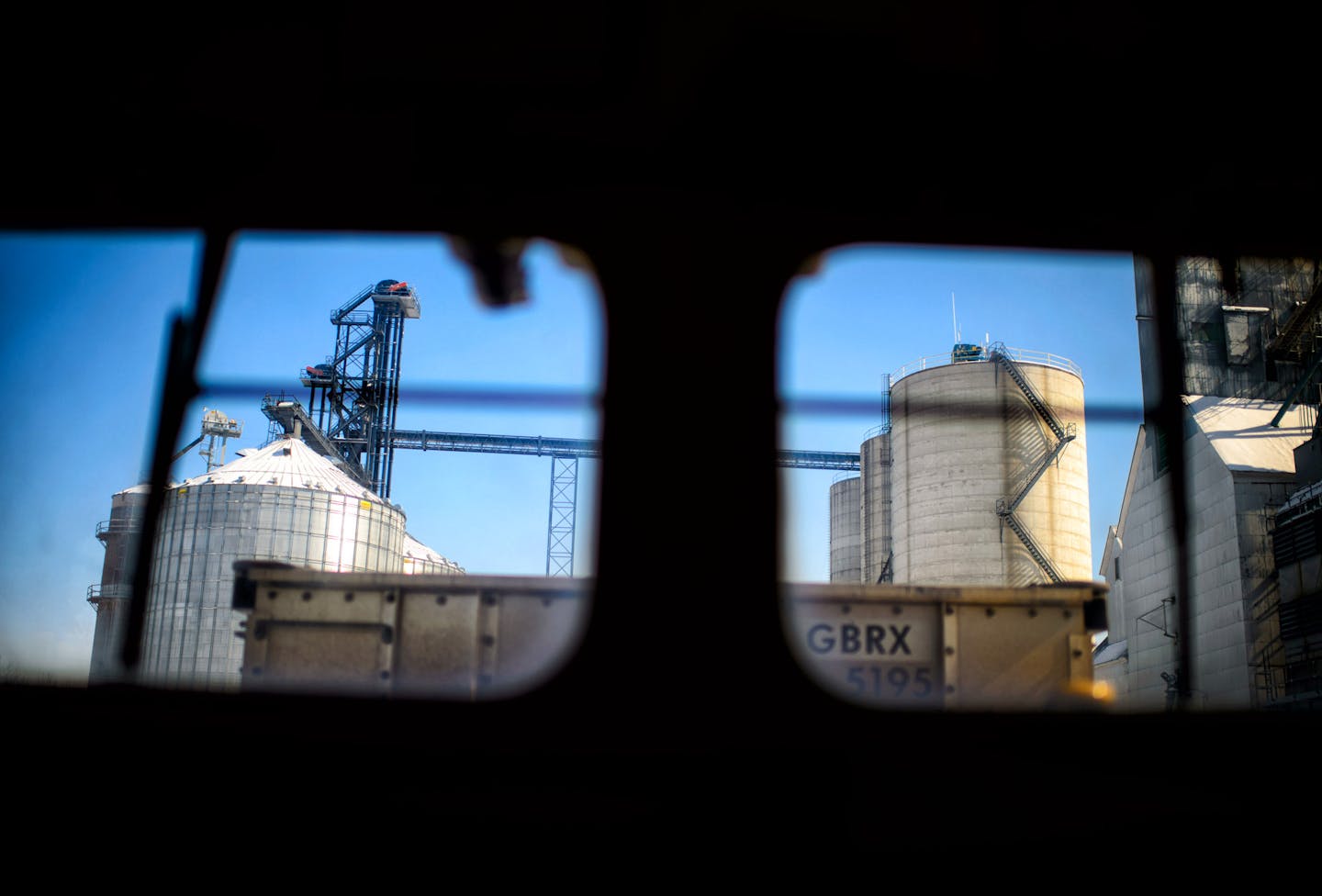 The train passed grain elevators in Hector, Minn.