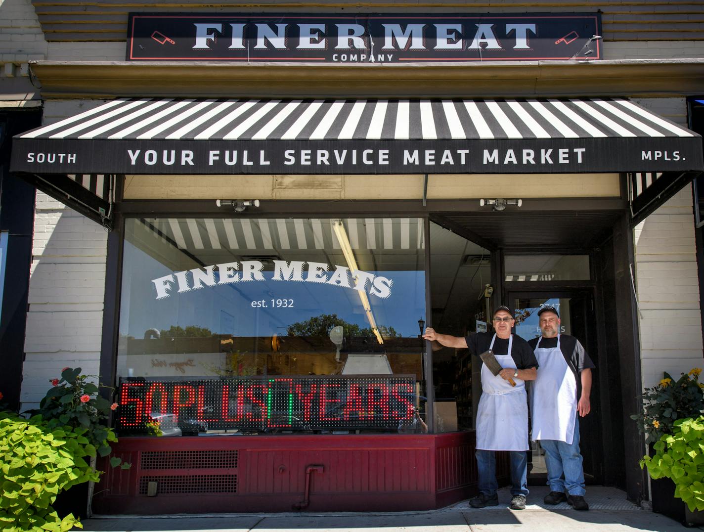 Using a city grant, Tim Knopik, left, with son Doug Meyer, was able to update the store and saw business improve. "Customers would wander in and ask, 'Is this a new store?' " Knopik said.