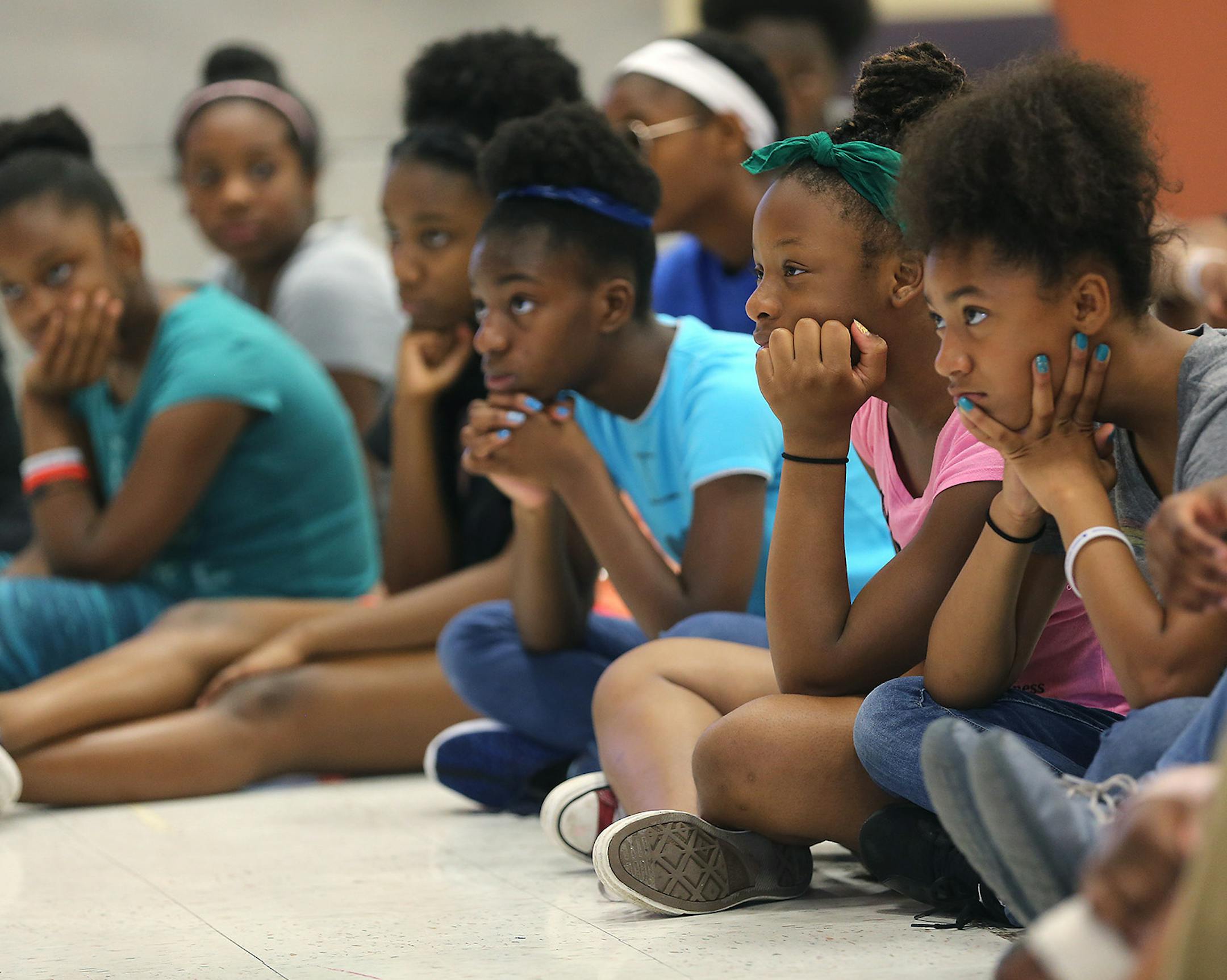 Students listened to a guest speaker read aloud to them at St. Paul City School on Wednesday, Aug. 3. It's one of four schools in St. Paul's Promise Neighborhood.