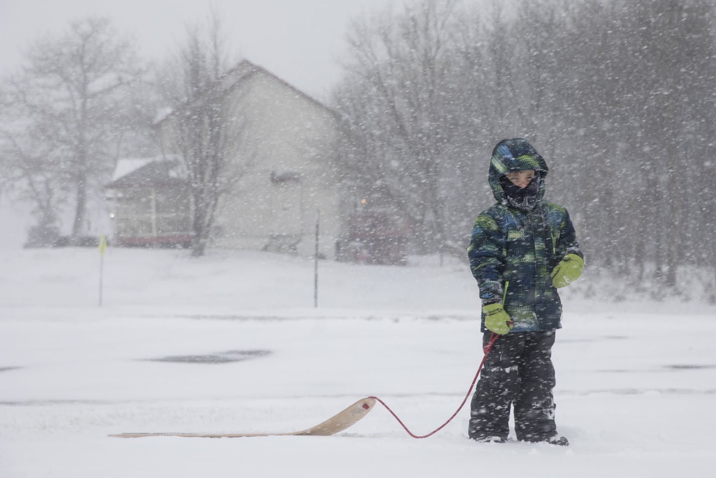 Mason Levitson bundled up at the park after his dad Mike Levitson braved taking his children to the park to sled during a snow day due to a snow storm hitting the metro on Monday, January 22, 2018 in Savage, Minn. ] RENEE JONES SCHNEIDER &#xa5; renee.jones@startribune.com