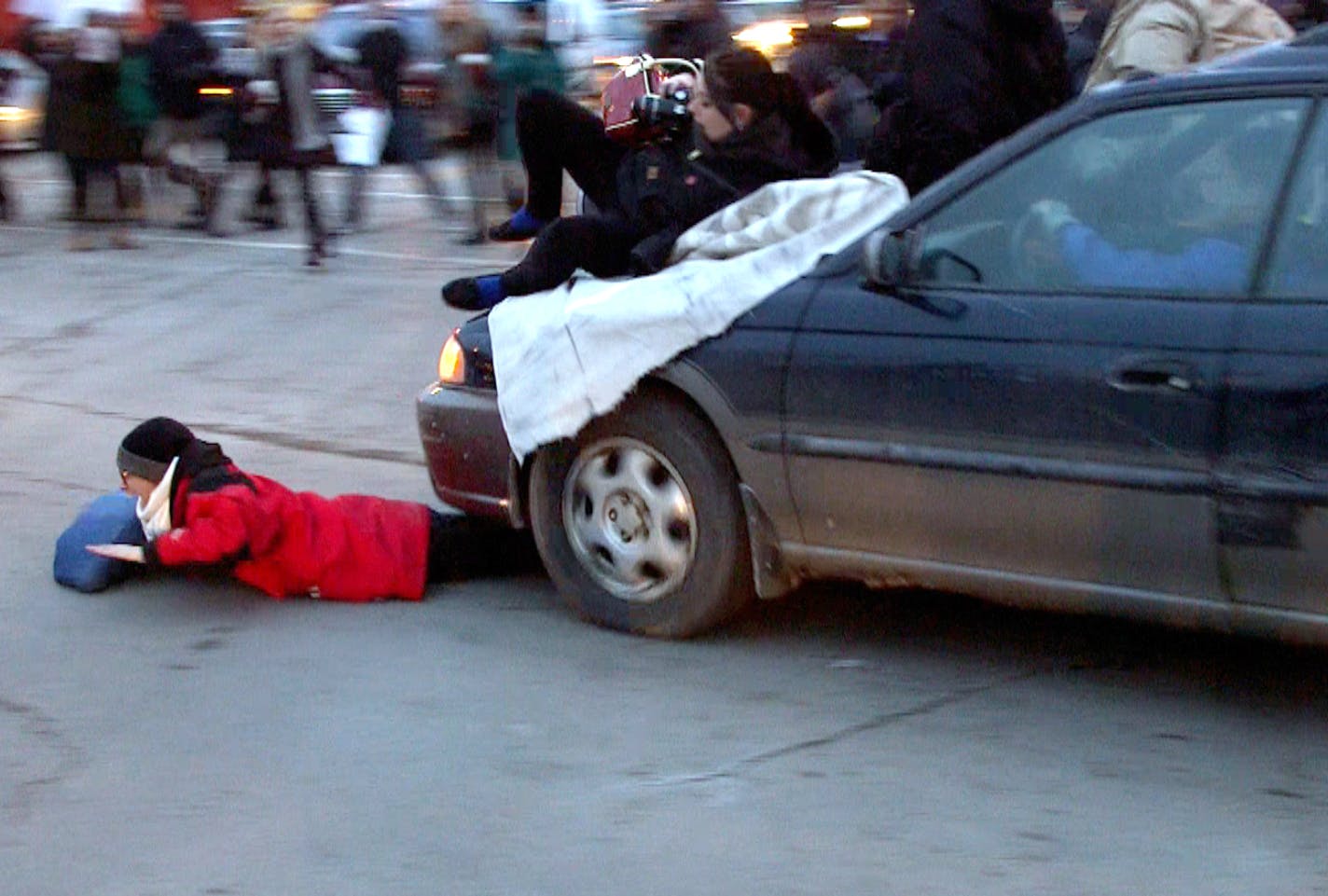 A car plowed through a Ferguson rally in south Minneapolis after protesters blocked the intersection of Lake Street and Minnehaha Avenue on Tuesday, Nov. 25, 2014 .