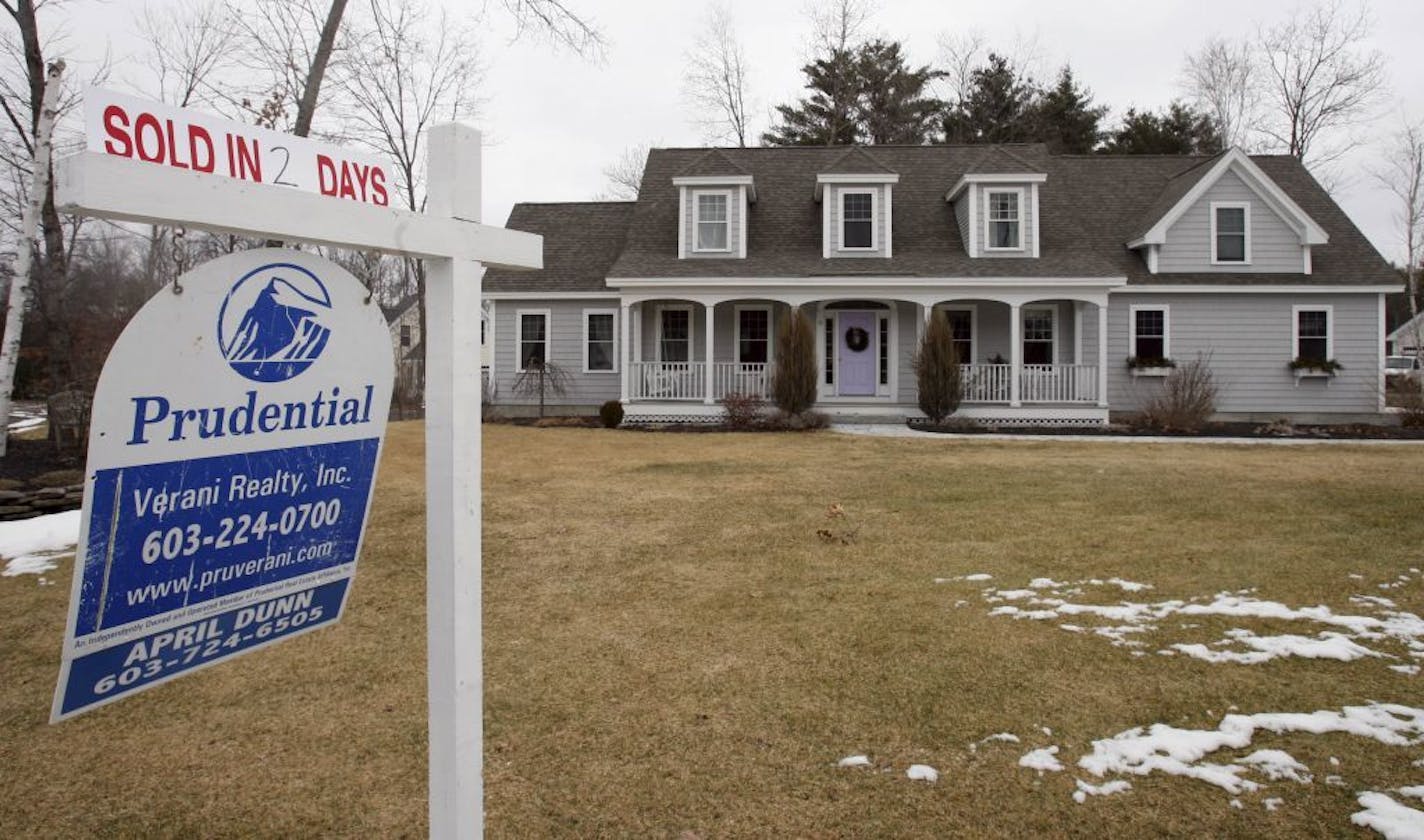 In this Feb. 23, 2010 photo, a "Sold in 2 Days" sign is seen at a home for sale in Concord, N.H. Sales of previously occupied homes took a large drop for the second straight month in January, falling to the lowest level since summer. It was another sign the housing market's recovery is faltering.