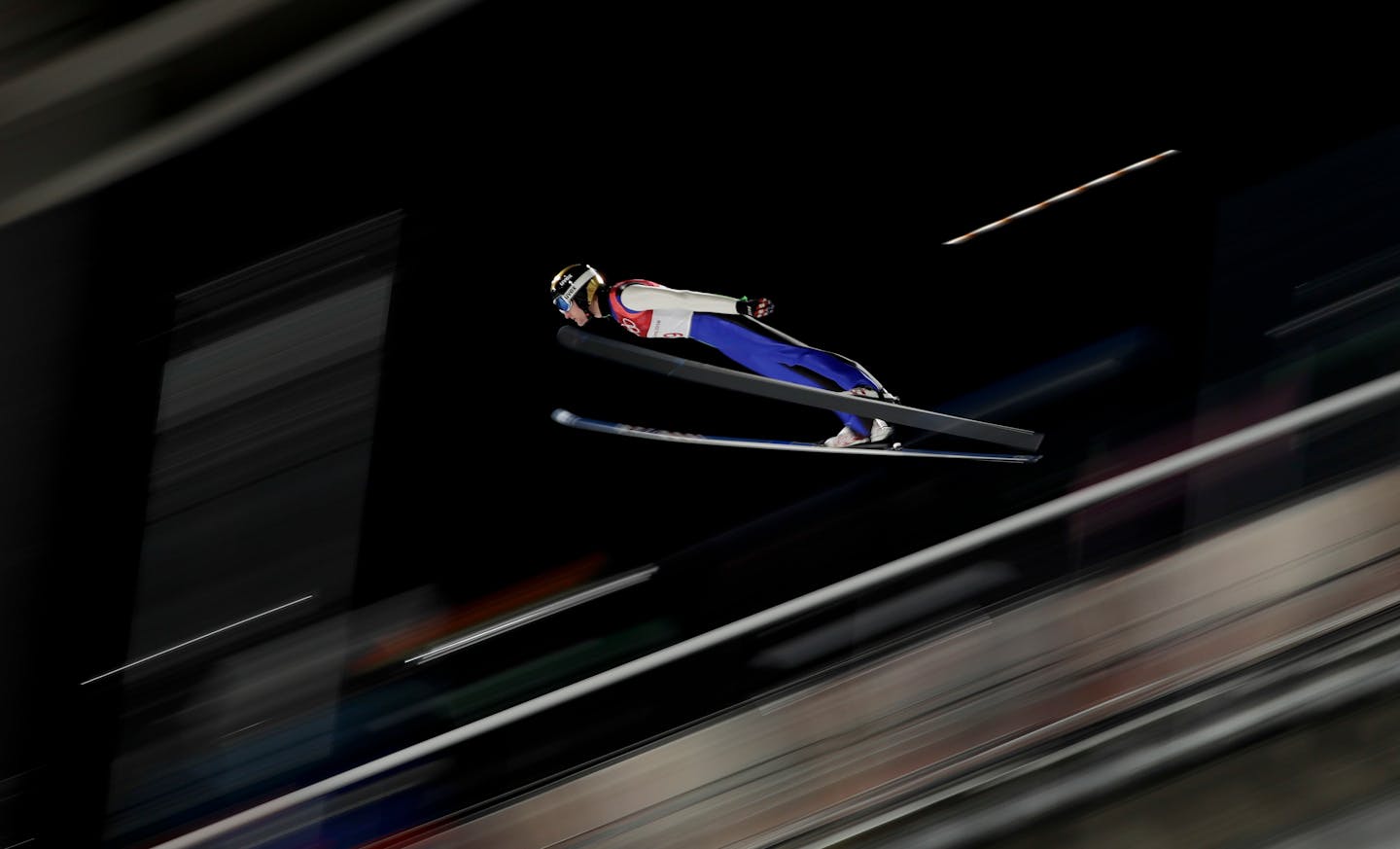 Michael Glasder, of the United States, soars through the air during the men's normal hill individual ski jumping qualifier ahead of the 2018 Winter Olympics in Pyeongchang, South Korea, Thursday, Feb. 8, 2018. (AP Photo/Matthias Schrader)