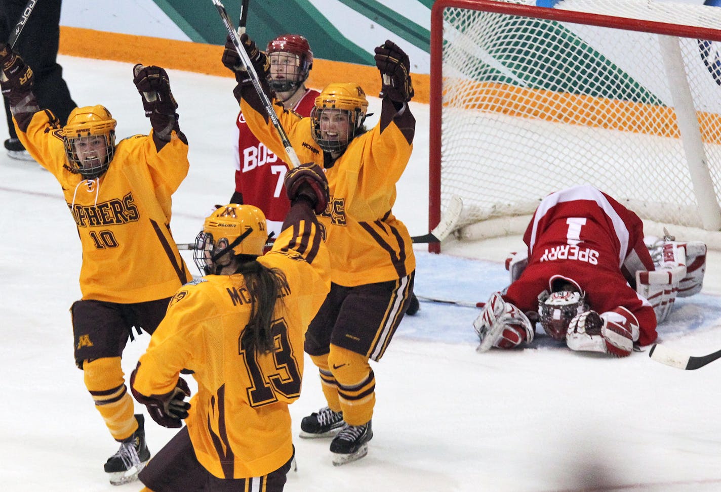 Frozen Four championship game - Minnesota Gophers vs. Boston University (BU) Terriers. Gophers celebrated after Milicaa McMillen (13) knocked the puck past BU goalie KerrinSperry in 2nd period action. (MARLIN LEVISON/STARTRIBUNE(mlevison@startribune.com (cq program)