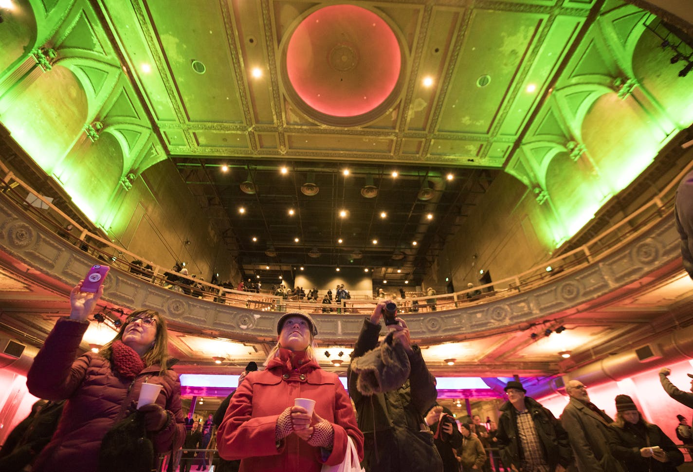 Kristi Jackson, center, of St. Paul, checks out the renovated Palace Theatre during a soft opening. "I'm so excited," said Jackson. "I live down here and it's gonna be great for the neighborhood...finally. Yay!" ] (Leila Navidi/Star Tribune) leila.navidi@startribune.com BACKGROUND INFORMATION: An open house for the public at the newly renovated Palace Theatre in downtown St. Paul on Friday, December 16, 2016. With work on the downtown Palace Theatre music venue nearly complete, the city held an