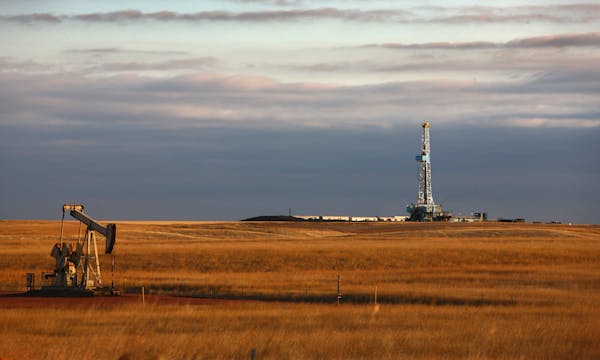 An oil drilling rig stands on the Bakken formation in Watford City, North Dakota, U.S., on Friday, Oct. 14, 2011. Oil production in the state has trip