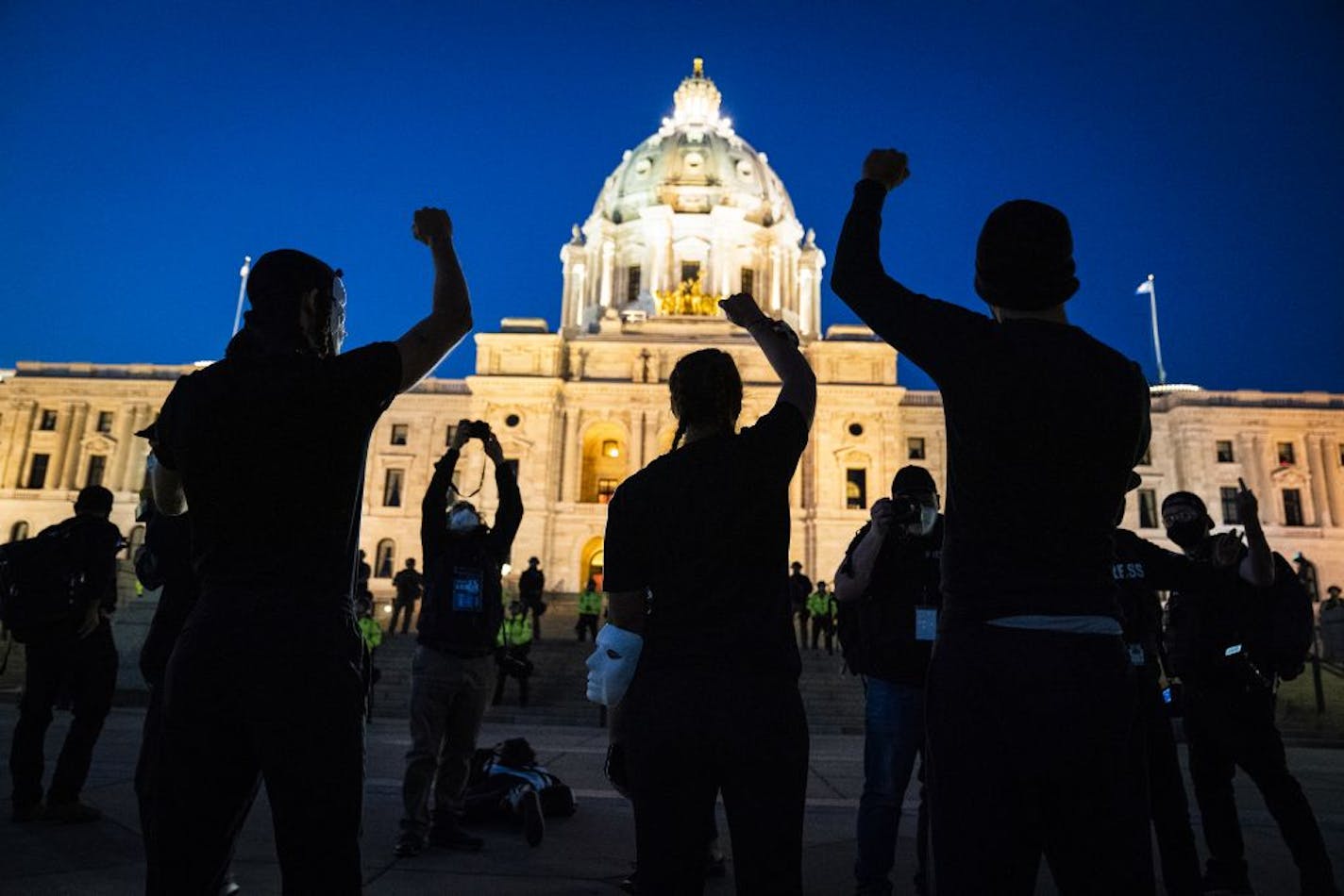 Families of those killed by police marched with hundreds of supporters in "The Secret March" down University Avenue to the Capitol in St. Paul. There they dropped several effigies of dead bodies and coffins along with a list of demands.