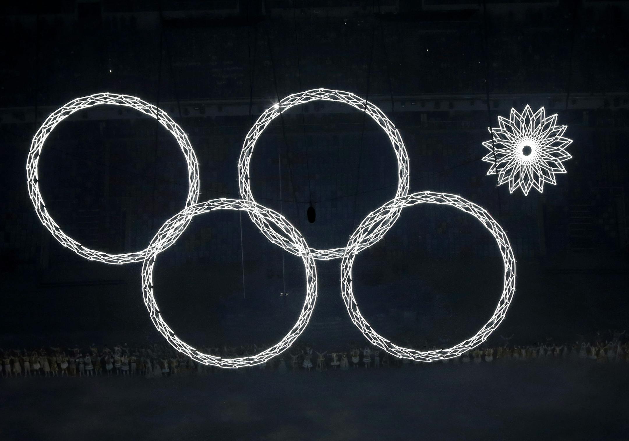 One of the Olympic rings fails to open during the opening ceremony of the 2014 Winter Olympics in Sochi, Russia, Friday, Feb. 7, 2014. (AP Photo/David J. Phillip )