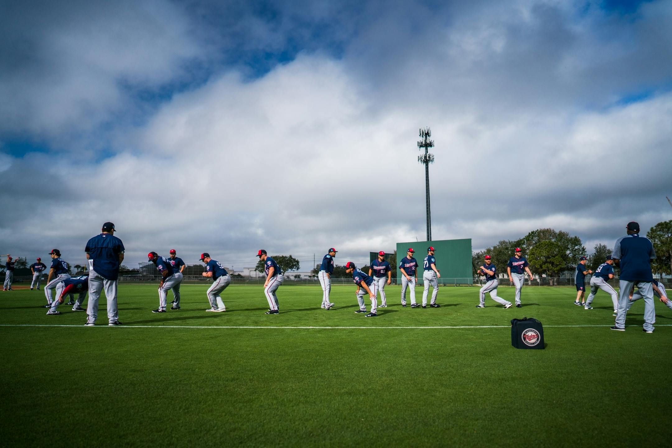 Pitchers and catchers ran drills on their first day of workouts.