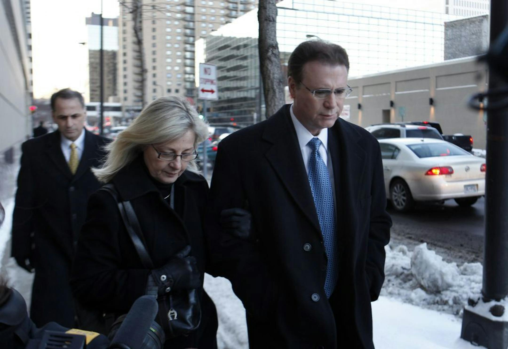 Steven Leach (right) (DO NOT PUBLISH UNTIL WE CONFIRM THIS PERSON!!) walked from�the U.S. Court House in Minneapolis on Thursday afternoon. Denny Hecker and Steven Leach pleaded not guilty on Thursday afternoon to federal charges that they defrauded Chrysler Financial Corp.