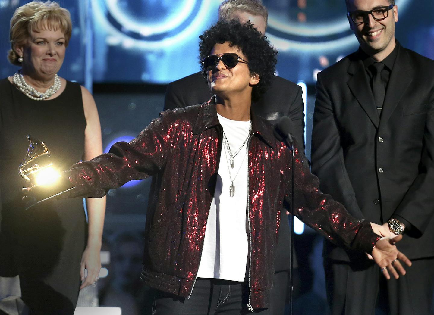 Bruno Mars accepts the award for record of the year for "24K Magic" at the 60th annual Grammy Awards at Madison Square Garden on Sunday, Jan. 28, 2018, in New York. (Photo by Matt Sayles/Invision/AP) ORG XMIT: MIN2018012821533436