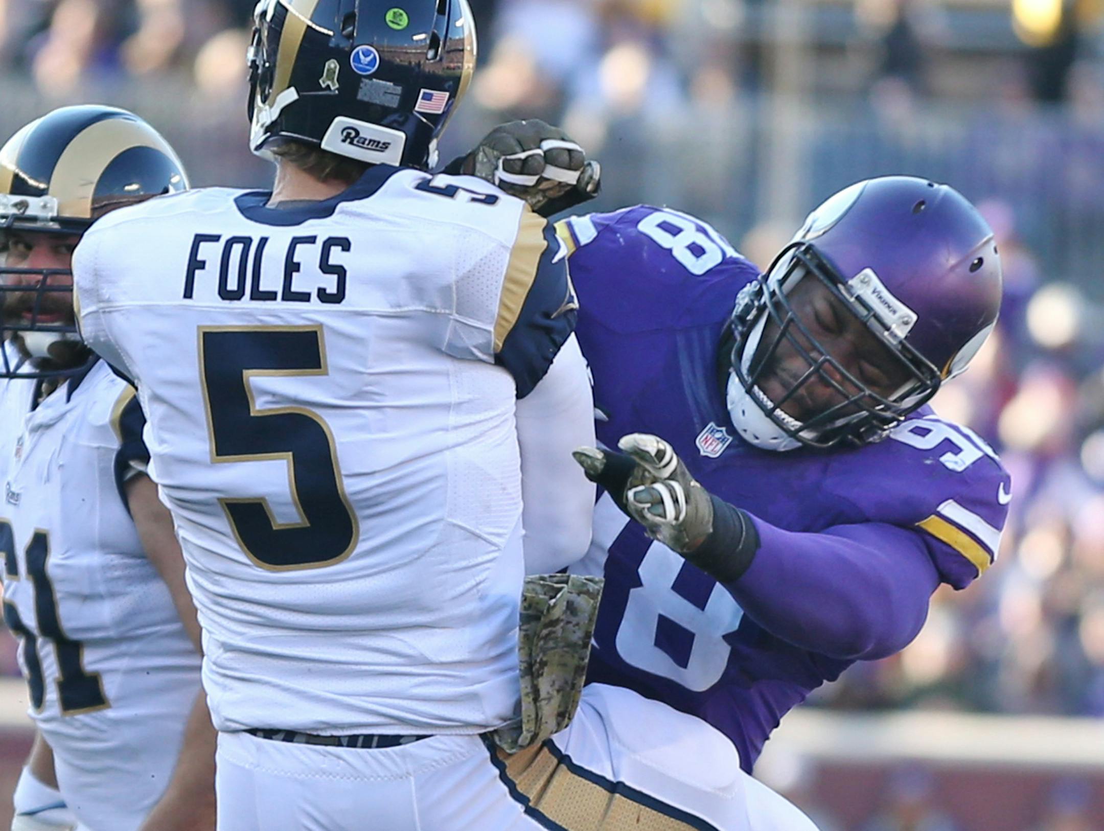 Minnesota Vikings defensive tackle Linval Joseph (98) pressed St. Louis Rams quarterback Nick Foles (5) into throw an incomplete pass in the third quarter Sunday November 8, 2015 in Minneapolis, MN. ] The Minnesota Vikings beat the St. Louis Rams 21-18 in overtime at TCF Bank Stadium. Jerry Holt/ Jerry.Holt@Startribune.com