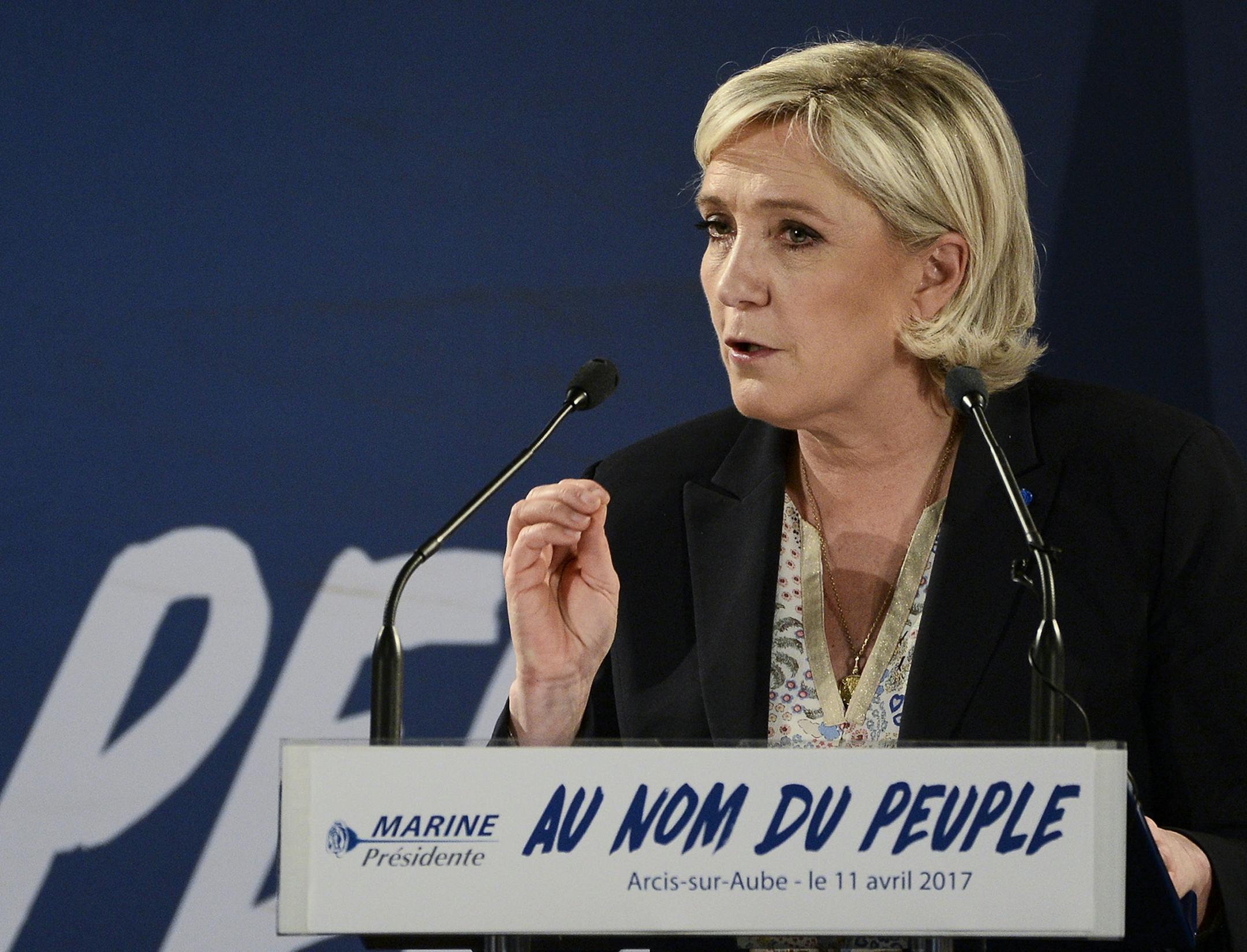 Far-right candidate for the presidential election Marine Le Pen speaks during a campaign meeting in Arcis-sur-Aube, near Troyes, France, Tuesday, April 11, 2017. Le Pen argues that Muslim immigration and economic globalization are destroying France's identity, and polls suggest she could advance to the second round of France's presidential election, set for April 23 and May 7. (AP Photo/Kamil Zihnioglu) ORG XMIT: MIN2017041713035639