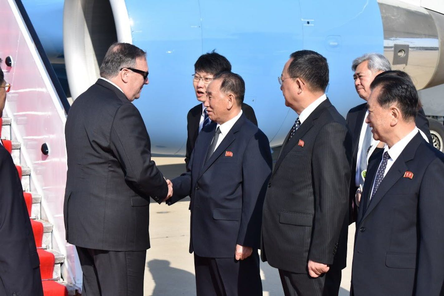 U.S. Secretary of State Mike Pompeo is greeted by senior North Korean official Kim Yong Chul, director of the United Front Department, which is responsible for North-South Korea affairs (left), and Foreign Minister Ri Su Yong, on his arrival in Pyongyang, North Korea, Wednesday, May 9, 2018. Pompeo met with North Korean leader Kim Jong Un later and secured the release of three American prisoners ahead of a planned summit between Kim and President Donald Trump.