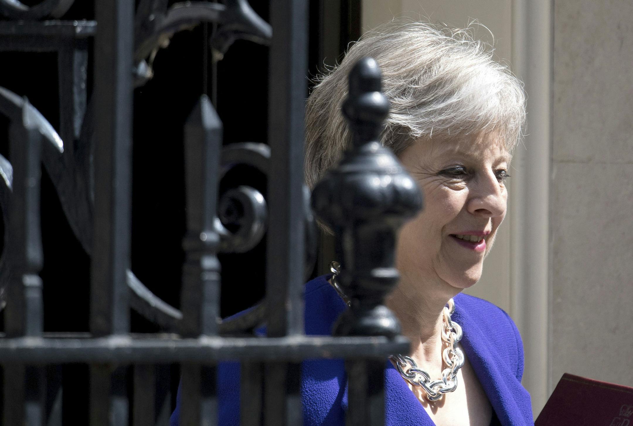 Britain's Prime Minister Theresa May leaves 10 Downing Street in London, bound for the House of Commons to face Prime Minister's Questions, Wednesday July 4, 2018. (Dominic Lipinski/PA via AP)