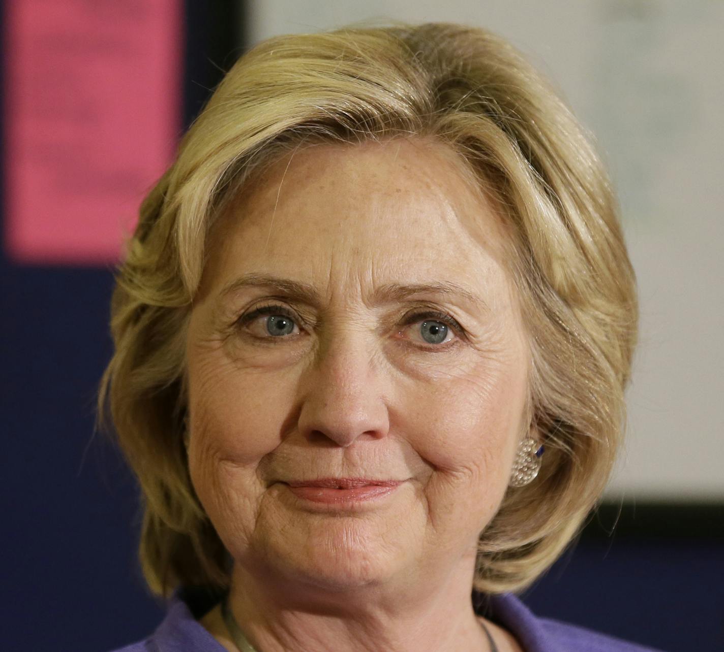 Democratic presidential candidate Hillary Rodham Clinton looks on as she is introduced to speak during a campaign stop at Uncle Nancy's Coffee House, Sunday, Sept. 6, 2015, in Newton, Iowa. (AP Photo/Charlie Neibergall) ORG XMIT: MIN2015100114441029