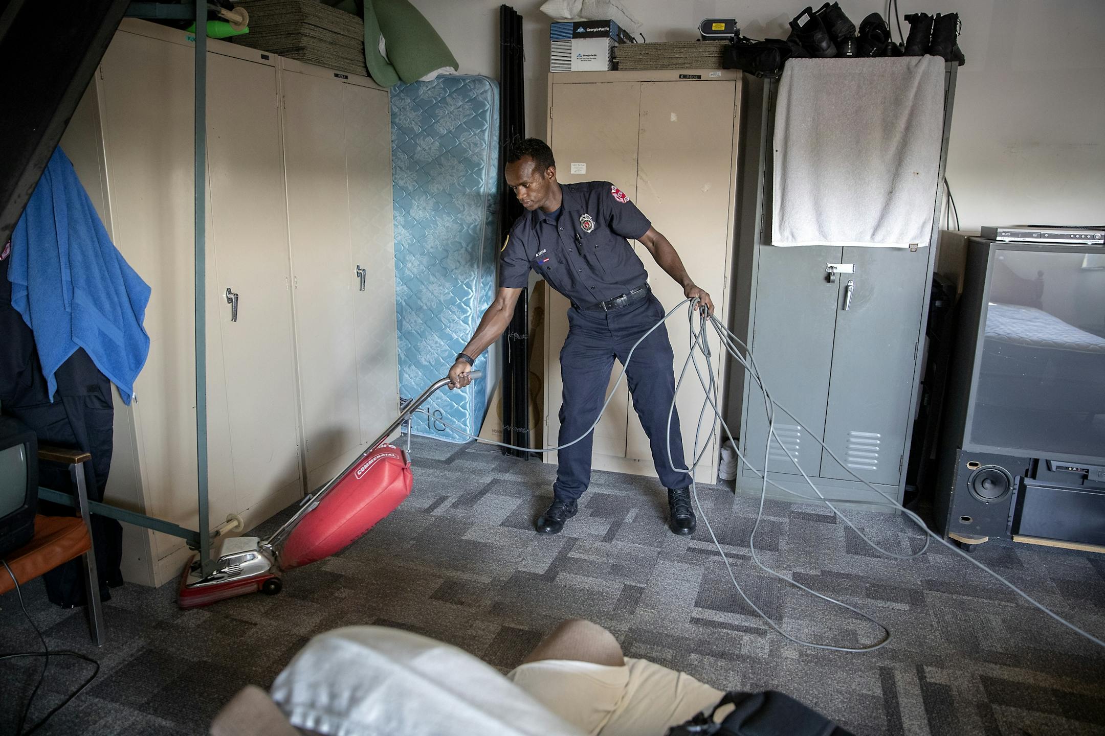 St. Paul firefighter Mohamed Daoud performed one of his duties as a pool firefighter during his second day on the job as one of the first Somali Americans to be sworn into the St. Paul fire department.