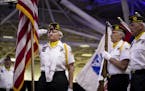 Julia Ross, of Post 230 Color Guard of Stockton, Mo., saluted the flag as they competed in the Color Guard contest at the American Legion 100th Nation