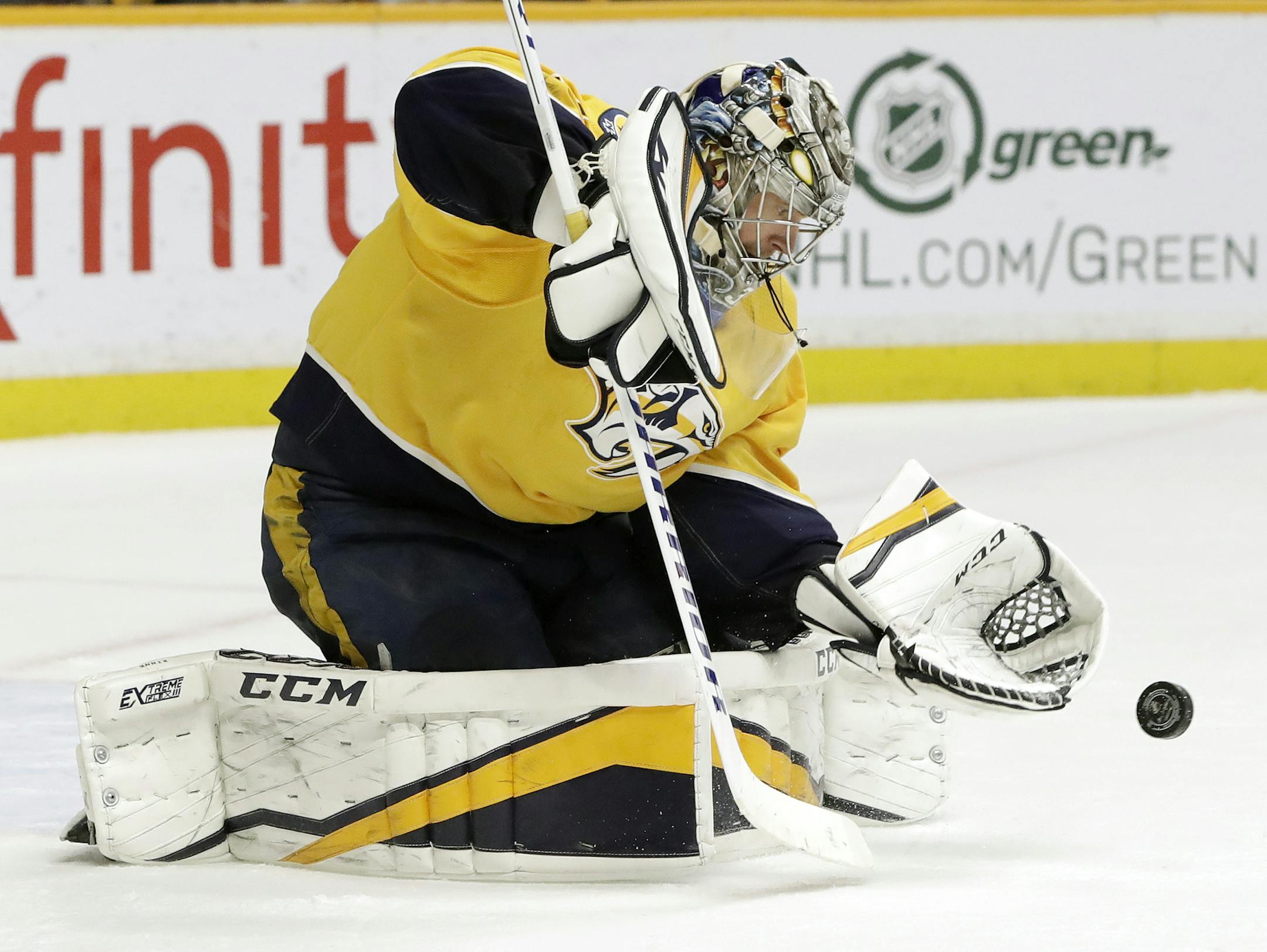 Nashville Predators goalie Pekka Rinne, of Finland, blocks a shot against the Winnipeg Jets in the third period of an NHL hockey game Tuesday, March 13, 2018, in Nashville, Tenn. The Predators won 3-1. (AP Photo/Mark Humphrey)