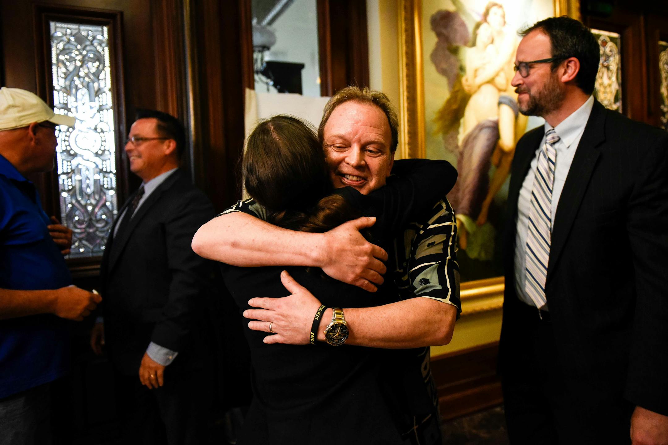 Childhood abuse survivor Jamie Heutmaker embraced bankruptcy attorney Brittany Michael after Thursday's news conference detailing the settlement reached between abuse survivors and the Archdiocese of St. Paul and Minneapolis.