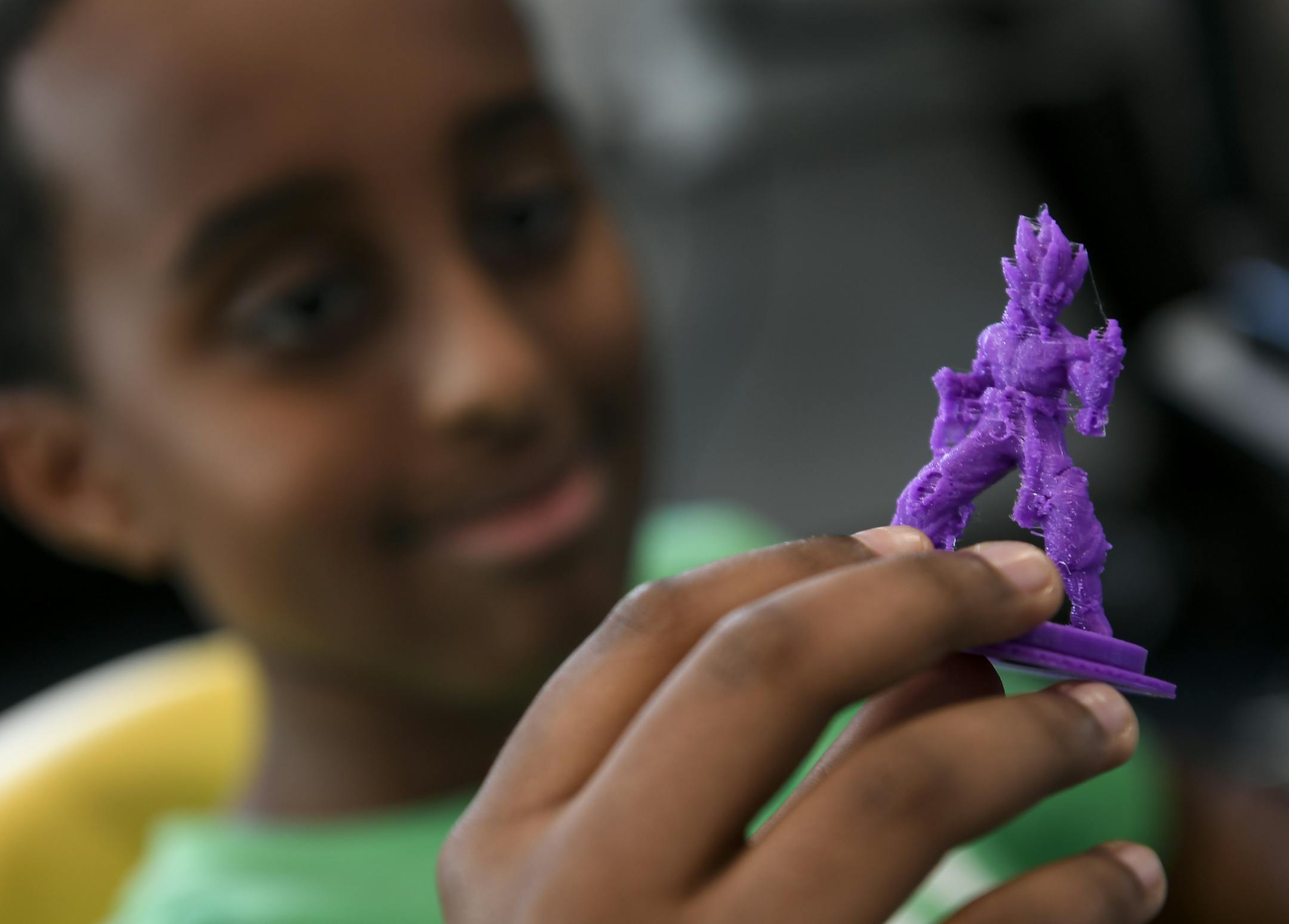 Ibrahim Ibrahim, 13, a student at Global Academy, held a freshly 3D-printed "Goku," a character from anime show "Dragonball Z," Thursday at Best Buy's Teen Tech Center in Minneapolis. ] Aaron Lavinsky ¥ aaron.lavinsky@startribune.com At Hope Community in the Phillips neighborhood students are given the opportunity to use high-end computers and technology equipments to complete student-led projects some of which have gone on to win national awards. We photograph the Best Buy Teen Tech Center