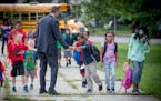 Minneapolis Superintendent Ed Graff greeted students as they made their way into Jenny Lind Elementary School on the first day of school, Monday, Augu