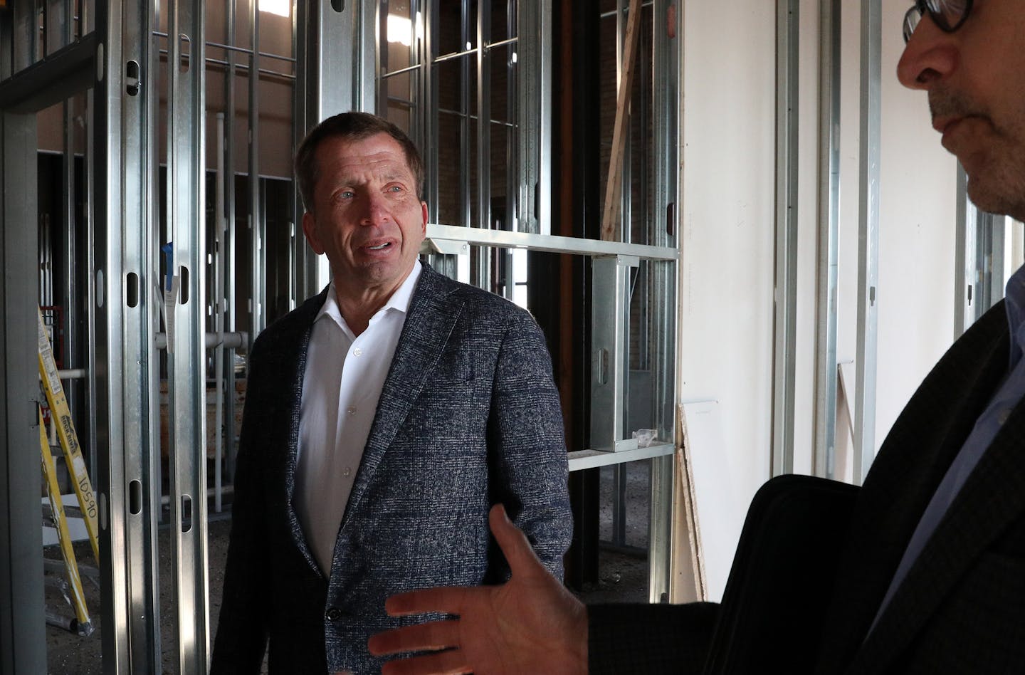 George Sherman, left, of Sherman Associates helped lead a tour of the Thresher Square