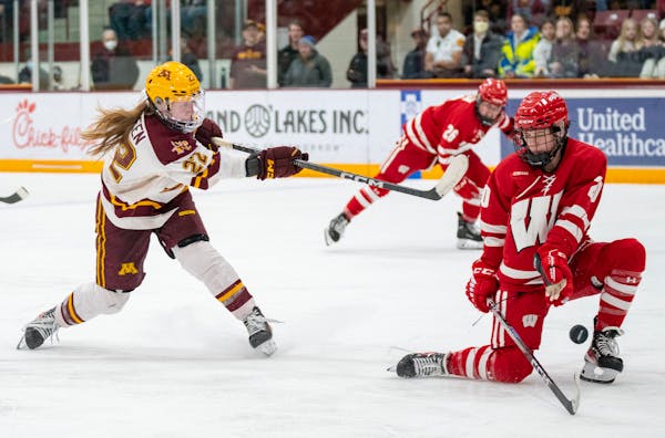 Minnesota forward Abigail Boreen (22), above vs. Wisconsin last weekend, had two goals in a 4-2 victory over St. Thomas on Saturday.