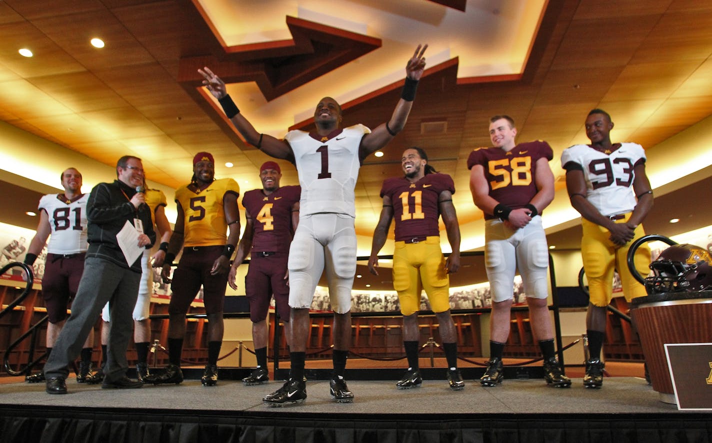 New uniforms for Gophers football team were unveiled Friday in the TCF Gophers locker room. Brandon Green (1) modeled a new uniform under the "M" insignia in the middle of the home locker room.