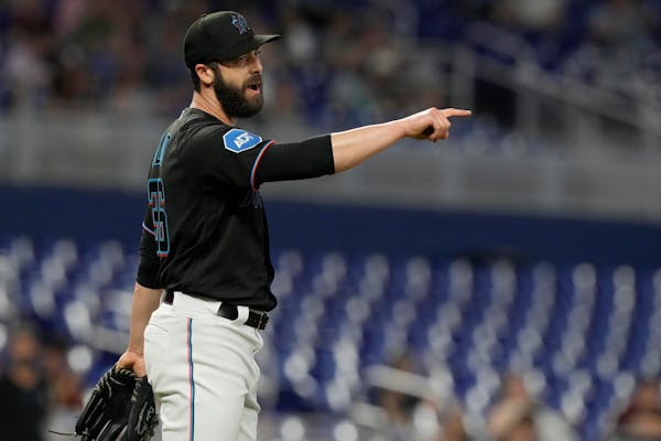 Miami Marlins relief pitcher Dylan Floro (36) gestures at the end of the ninth inning of a baseball game against the Washington Nationals, Thursday, M