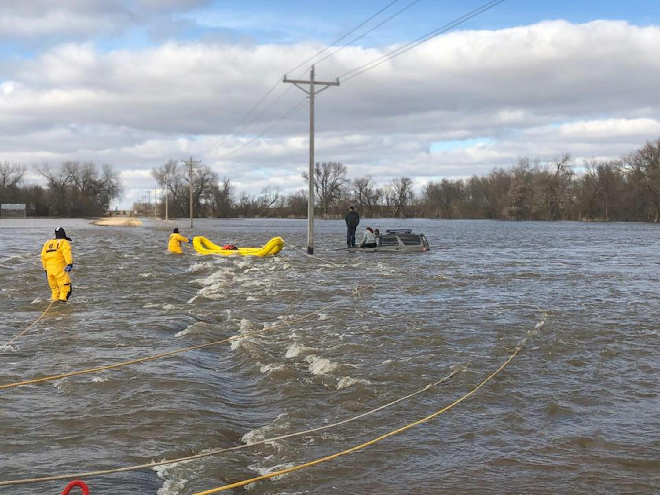 A man who ignored a road-closed sign and his female passenger were rescued from flood waters in Lac Qui Parle County.