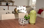 Accent pieces such as a vase are affordable ways to add color to a space, especially tabletop vignettes. (Handout/TNS) ORG XMIT: 1186220