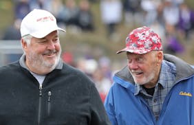 Mike and Bud Grant, at a 2018 ceremony at St. John’s.