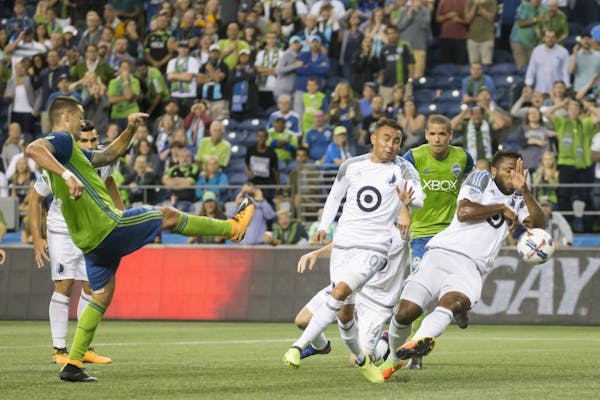 Minnesota United defender Jermaine Taylor commits a handball in the box to award the Sounders a penalty kick in stoppage time, on which Seattle Sounde