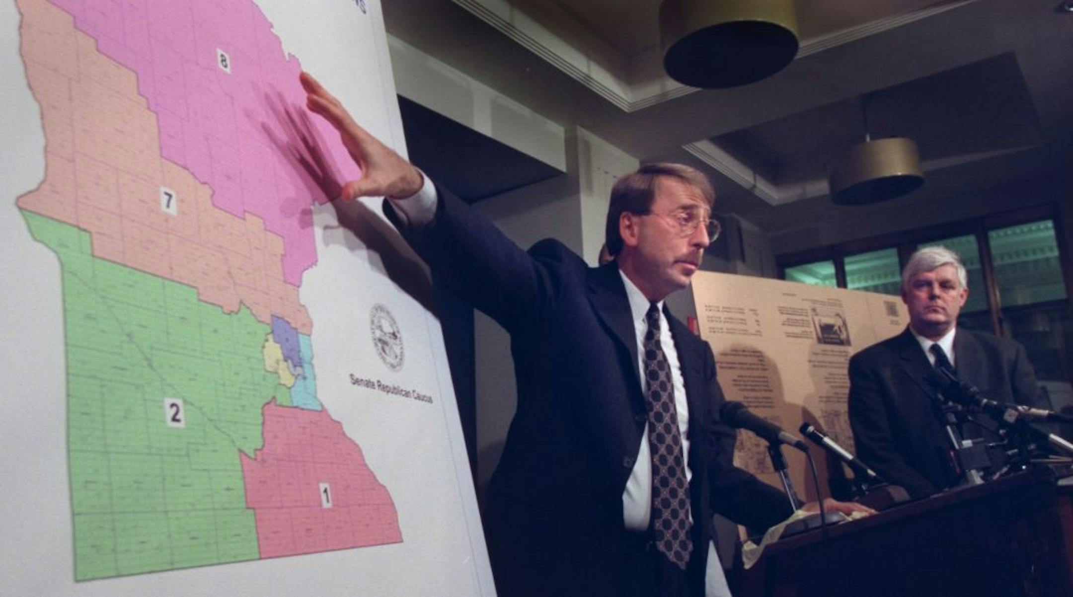 St. Paul, MN., Monday, 4/23/2001. (center) Member of the Senate Subcommittee on Redistricting, Senator Dave Kleis explained the Senate Republicans first redistricting plan for the state. The plan changes the boundaries for Minnesota's eight congressional diesticts by joining the cities of Minneapolis and St. Paul into one urban district. At right was Senator Tom Neuvill who along with Senators Bill Belanger and Tom Neuville (both not pictured) gave presentations on the redistricting plan. Senate