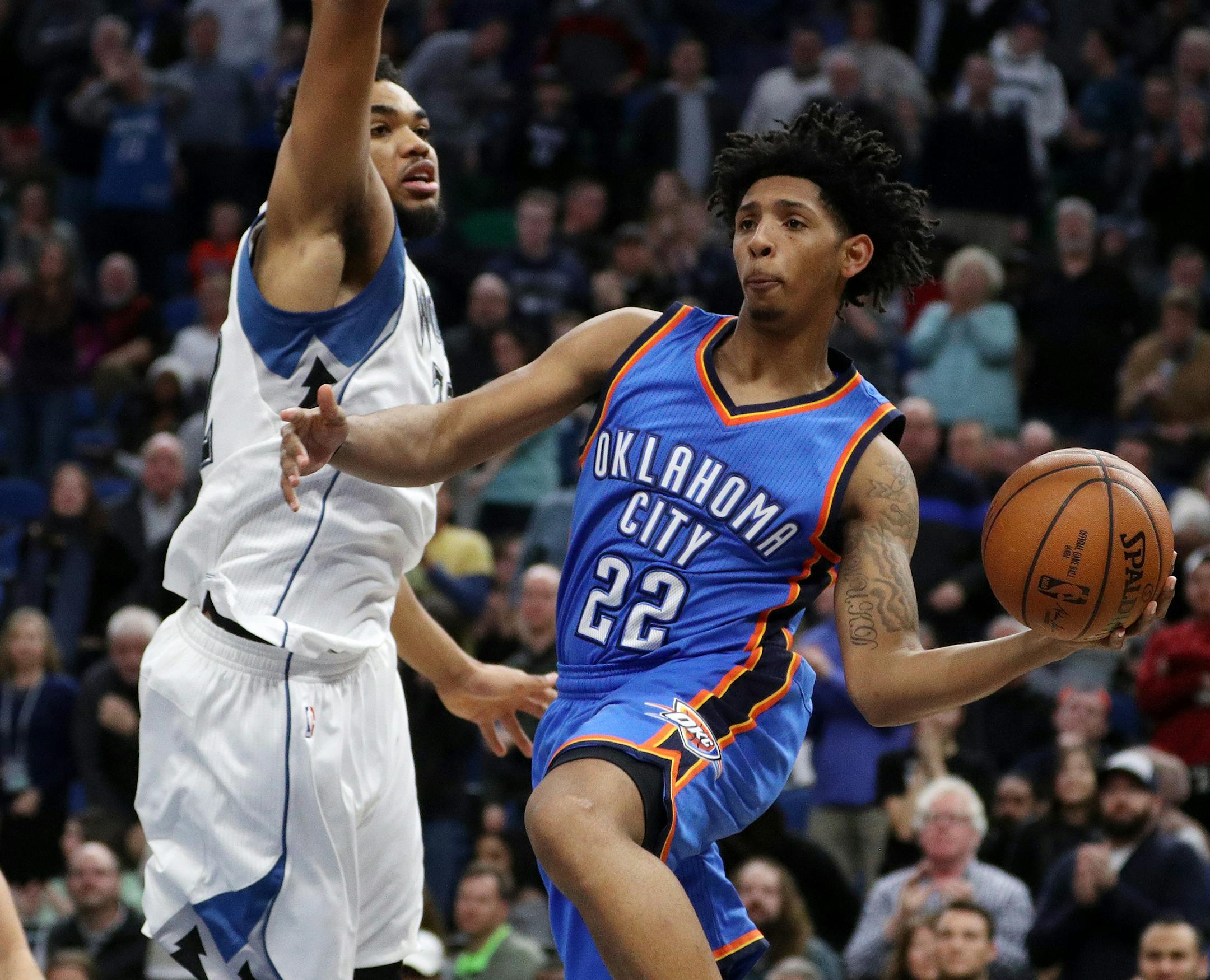 Oklahoma City Thunder guard Cameron Payne (22) looks to pass around Minnesota Timberwolves center Karl-Anthony Towns (32) during the second half. ] ANTHONY SOUFFLE • anthony.souffle@startribune.com The Minnesota Timberwolves played the Oklahoma City Thunder during an NBA game Friday, Jan. 13, 2017 at the Target Center in Minneapolis.