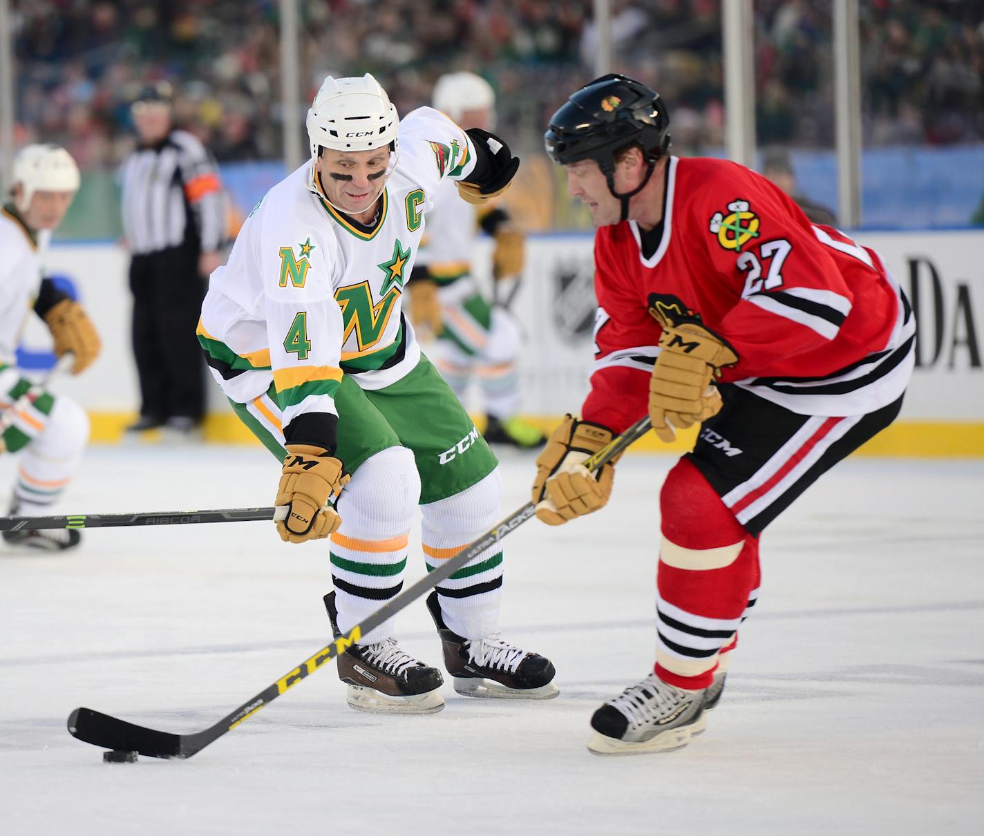 North Stars/Wild Alumni defender Craig Hartsburg (4) guarded Chicago Blackhawks forward Jeremy Roenick (27) in the second period Saturday. ] (AARON LAVINSKY/STAR TRIBUNE) aaron.lavinsky@startribune.com The 2016 Coors Light NHL Stadium Series alumni game was held Saturday, Feb. 20, 2016 at TCF Bank Stadium in Minneapolis, Minn.