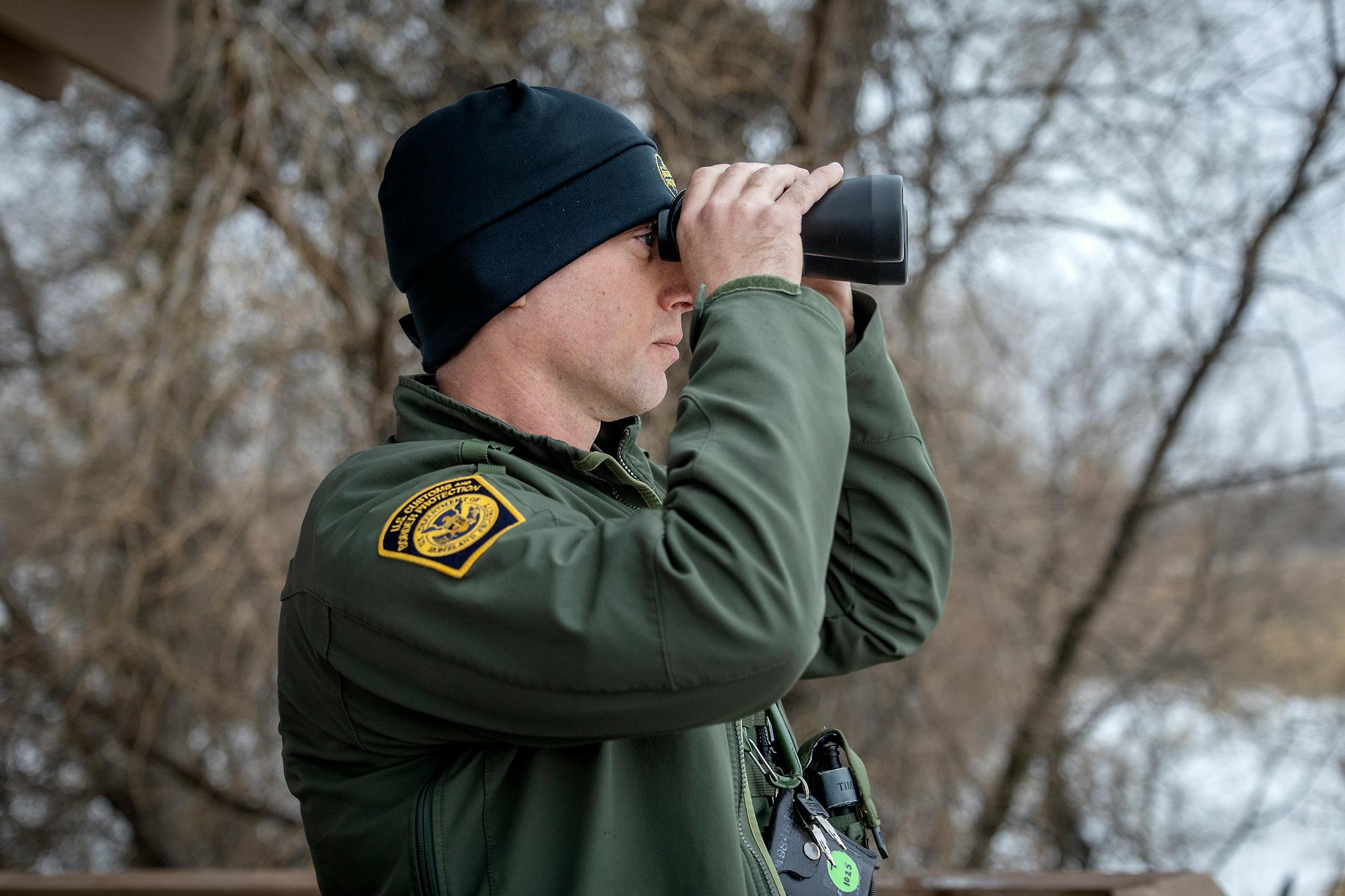 Jared Berg, a supervisor for border patrol agents at the Warroad station, observes activity on Lake of the Woods from an observation deck in Warroad, Minn., on Tuesday, March 22, 2022.