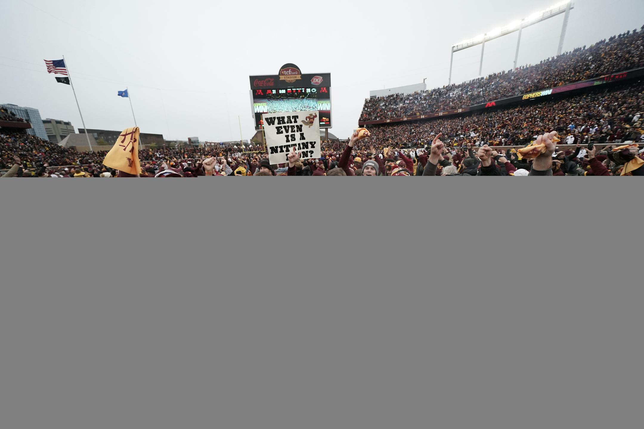 Gophers coach P.J. Fleck was swarmed by fans during a TV interview after beating Penn State.