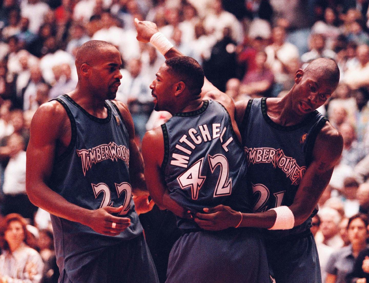 Kevin Garnett, right, tries to calm down Sam Mitchell after he was ejected during the second game of their NBA playoff series in Houston.