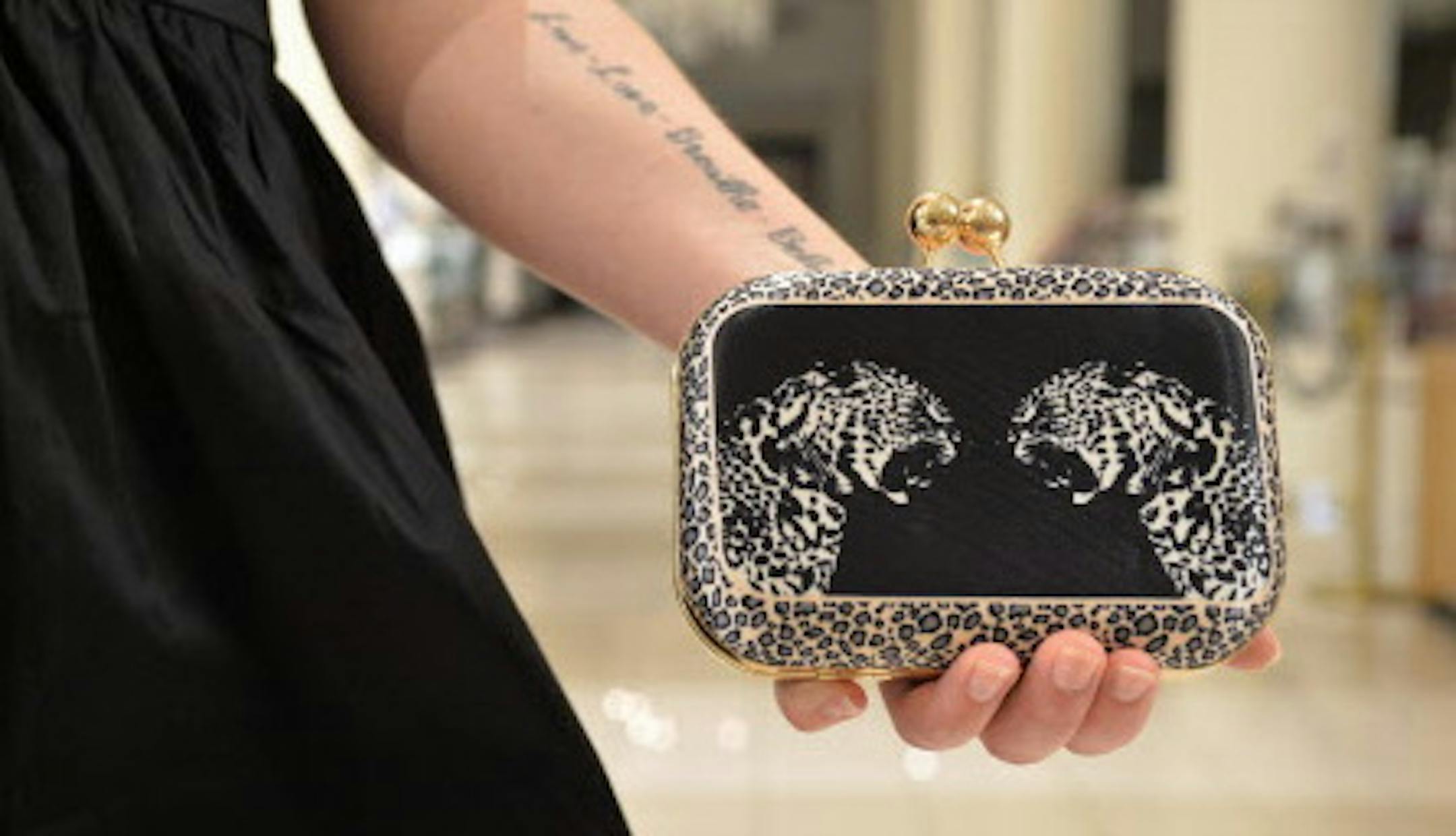 Erin Wahl. 34. Downtown Minneapolis. Job: Macy's Visual Department. Favorite item: BCBG boots, hard clutch. "I just bought the boots. They'll go great in the winter since we didn't have much of a summer." "I stumbled across a boutique in San Diego and found the hard clutch and just loved it." ] (SPECIAL TO THE STAR TRIBUNE/BRE McGEE) **Erin Wahl