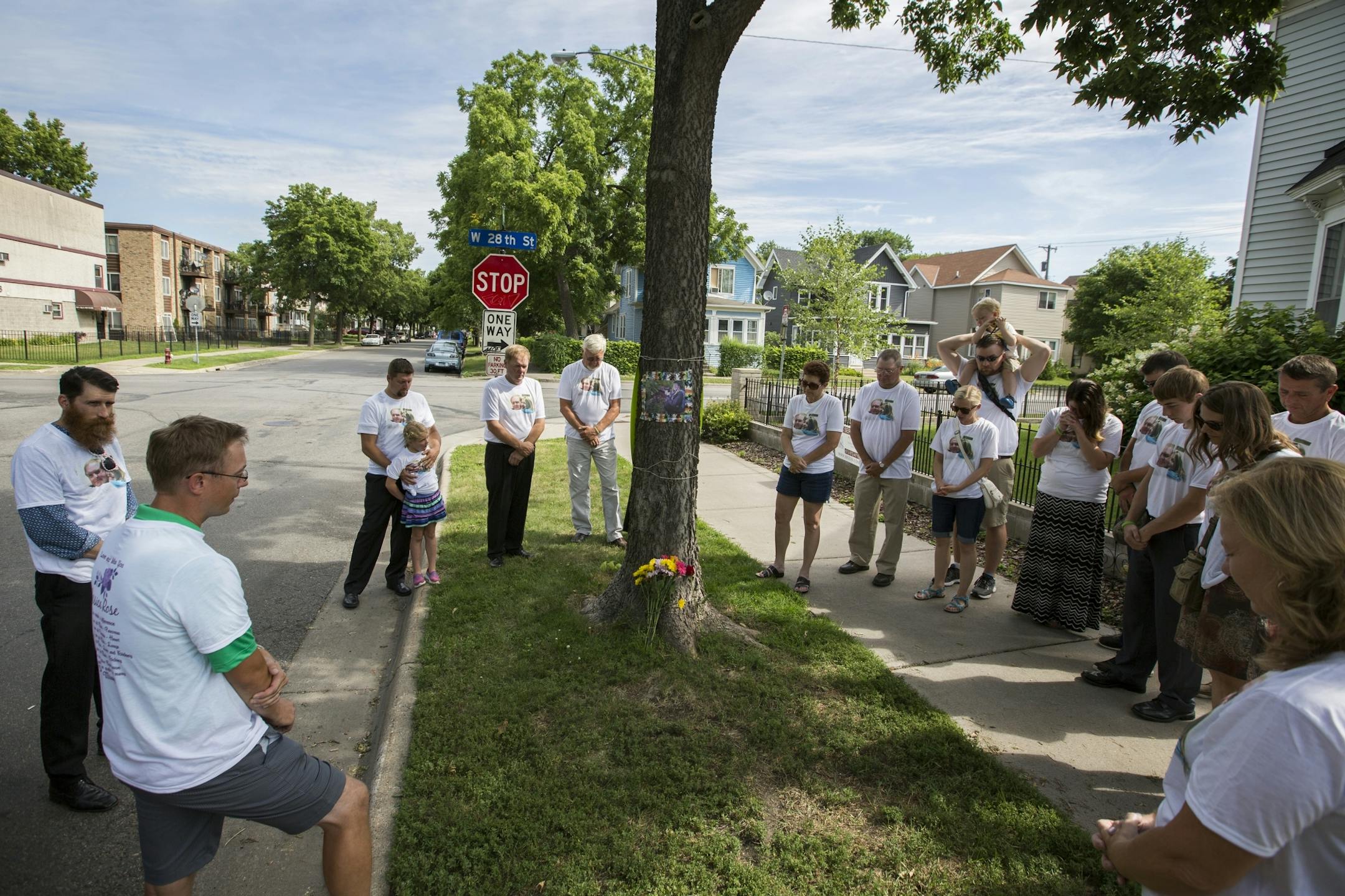 Family and friends pause for a moment of prayer during a memorial for Jessica Hanson in Minneapolis.