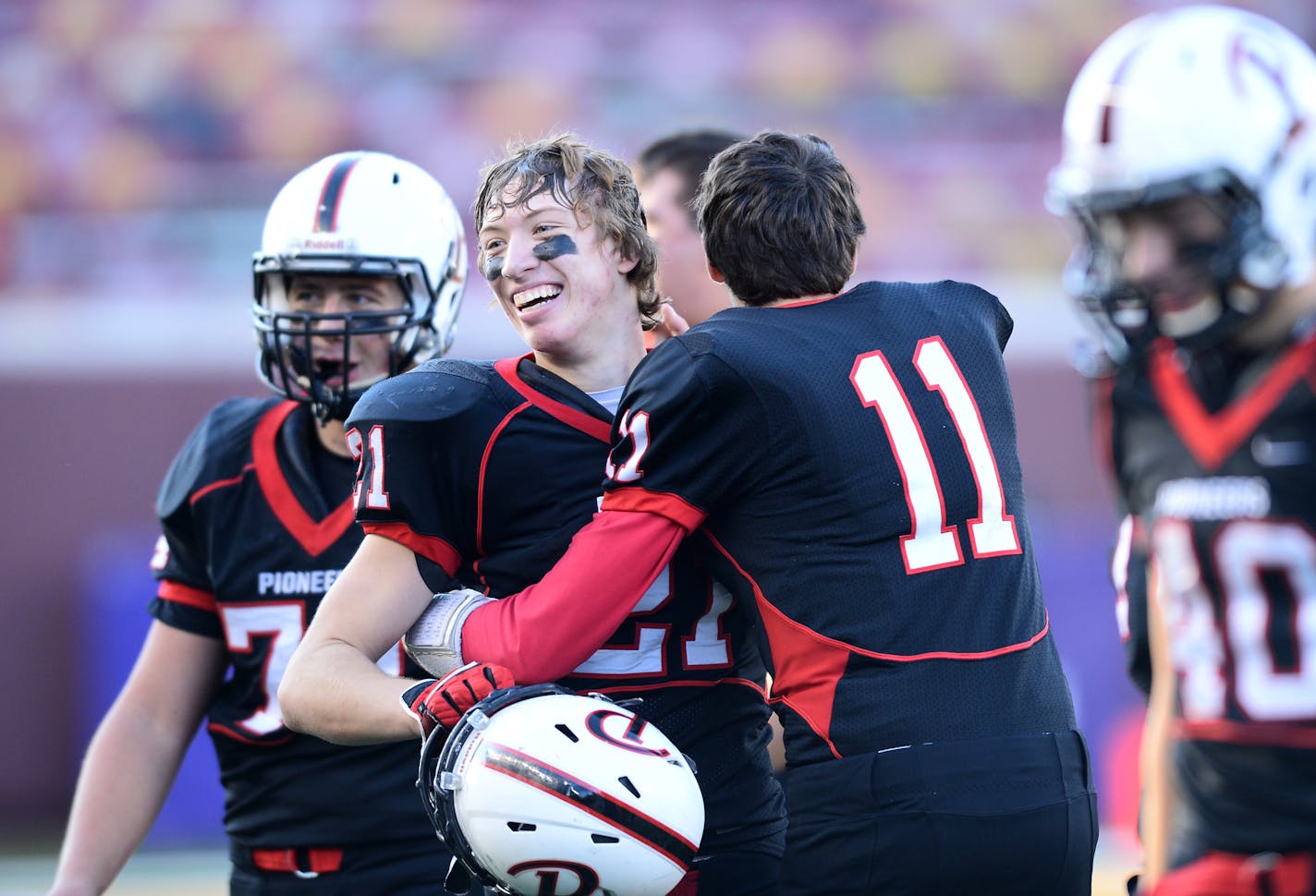 Pierz quarterback Aaron Weber (11) and tight end Matt Kummet (21) celebrated their team's 36-8 victory in the 3A championship game against Jackson County Central. ] (AARON LAVINSKY/STAR TRIBUNE) aaron.lavinsky@startribune.com Jackson County Central played Pierz in the Class 3A championship game on Saturday, Nov. 14, 2015 at TCF Bank Stadium.