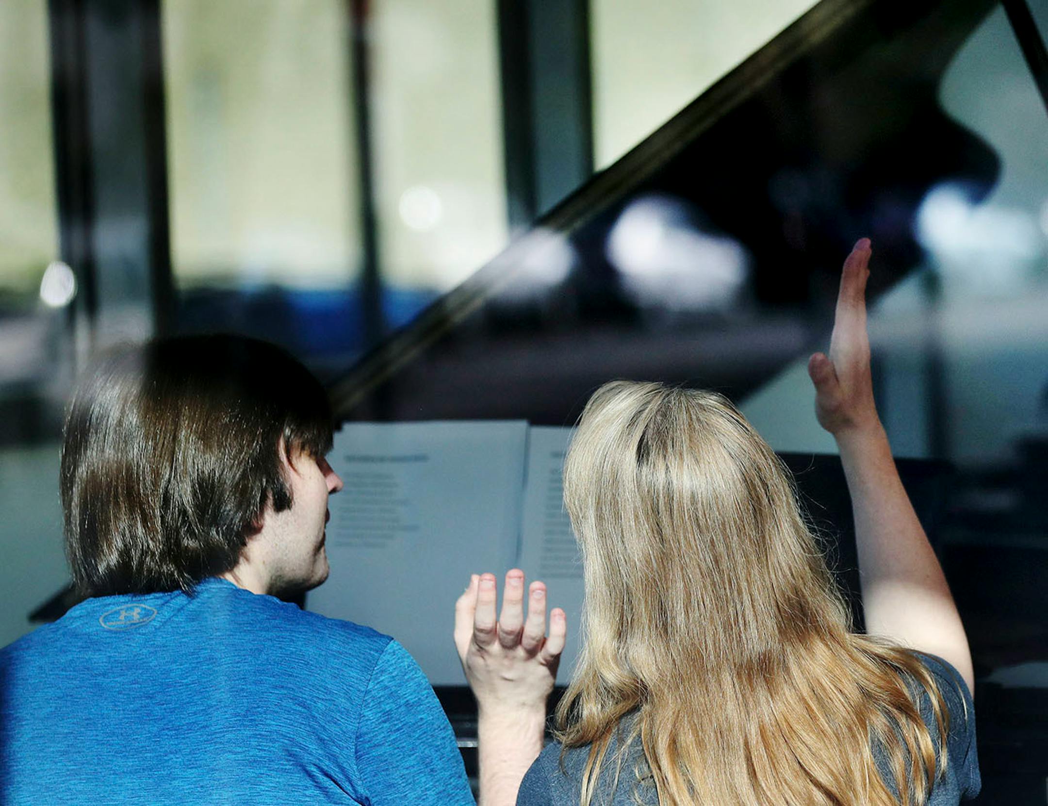 Alex Hagen, 21, has severe autism and limited speaking skills Hagen and Melissa Wenszell, MacPhail Music Therapy Co-Founder, Senior Music Therapist and Hagen's piano instructor, high five each other after Hagen finished a song at MacPhail Center for Music Tuesday, May 15, 2018, in Minneapolis, MN.