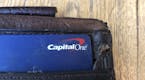 FILE - In this July 16, 2019, file photo a Capital One credit card is shown in a wallet in San Francisco. A security breach at Capital One Financial, 